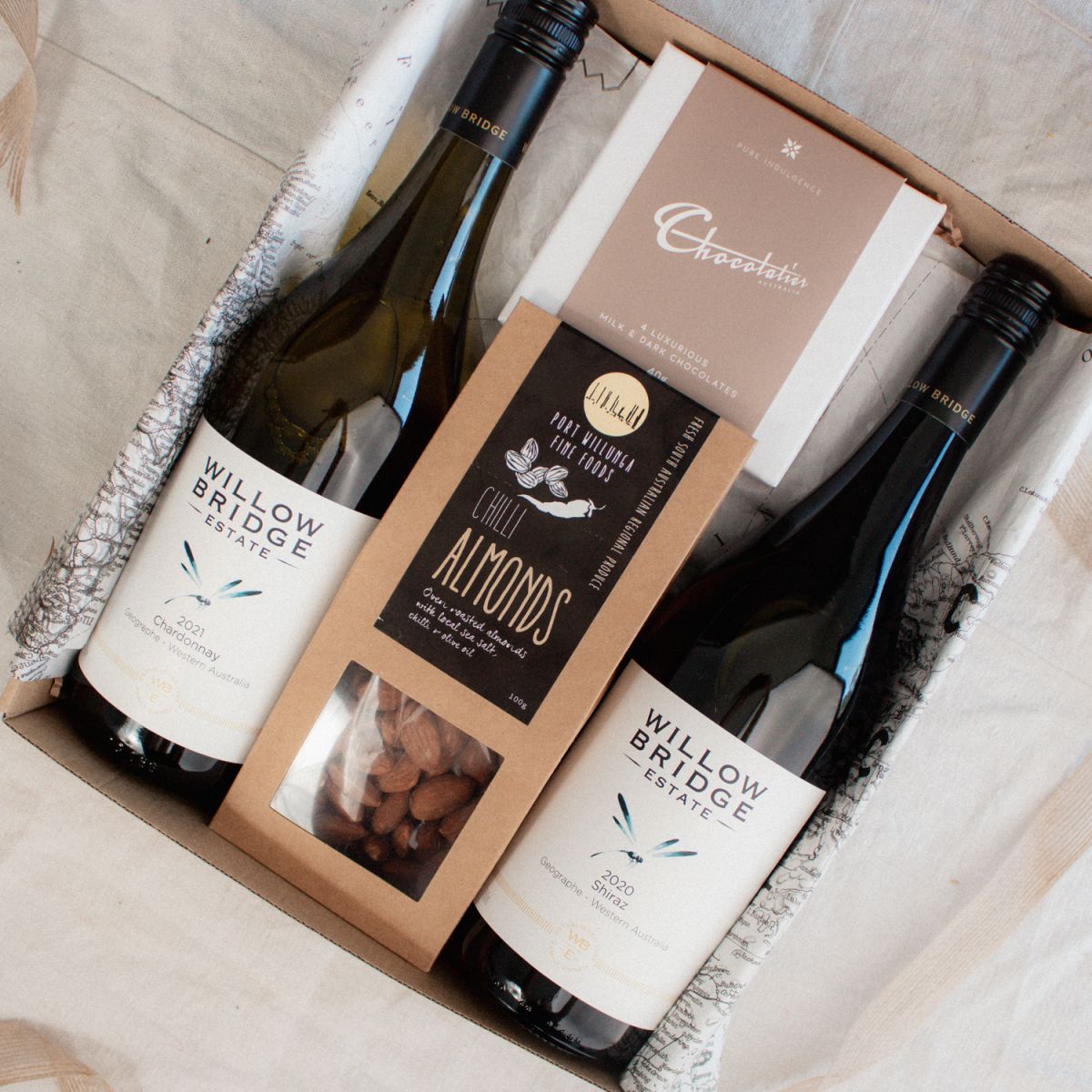 gift box for real estate clients, with wine, chocolates and almonds